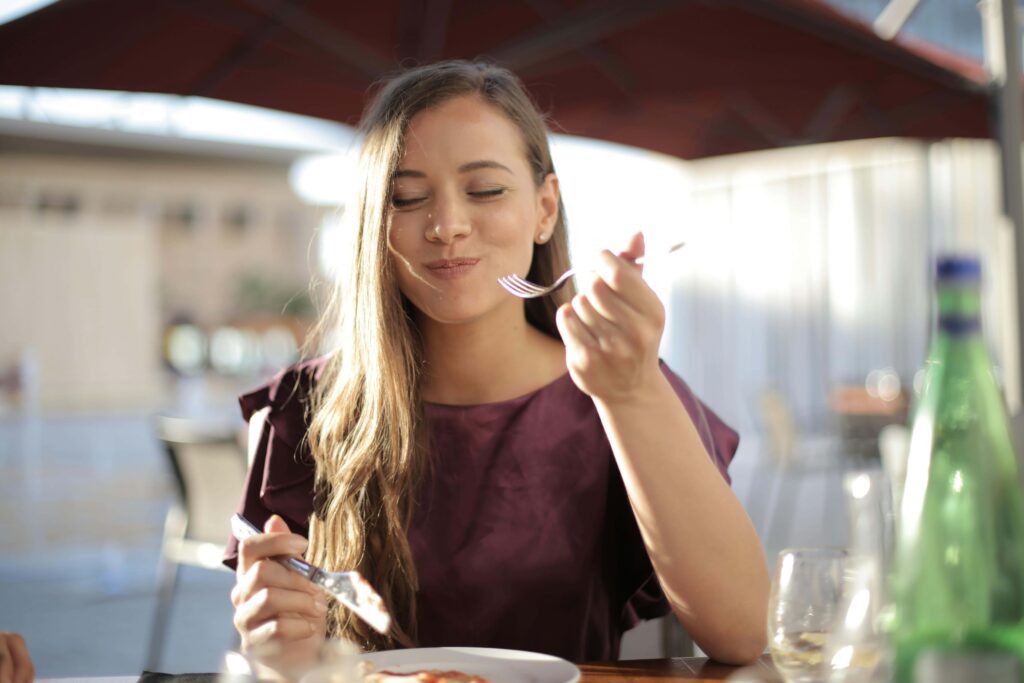 girl with braces eating