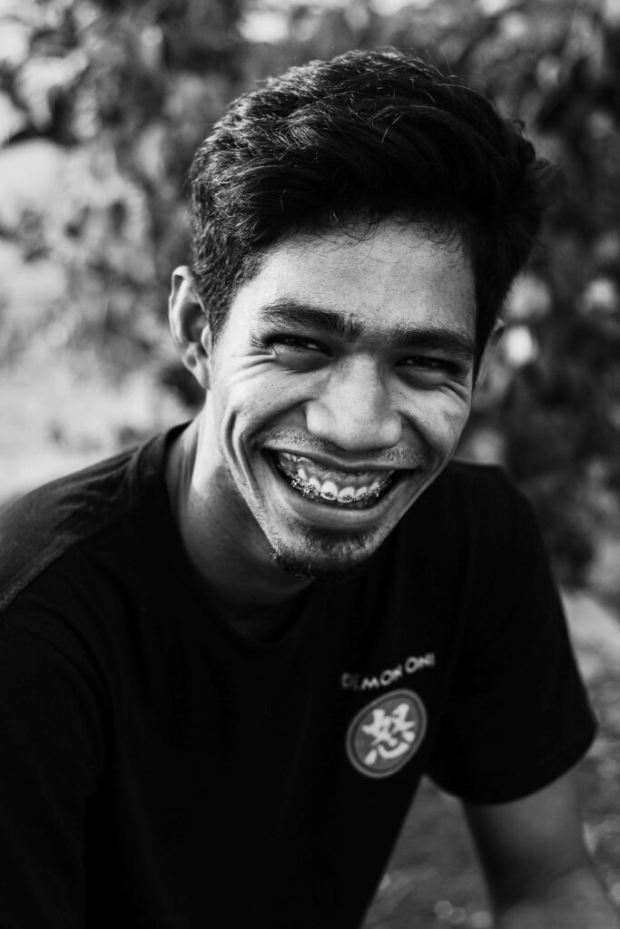 man with braces smiling